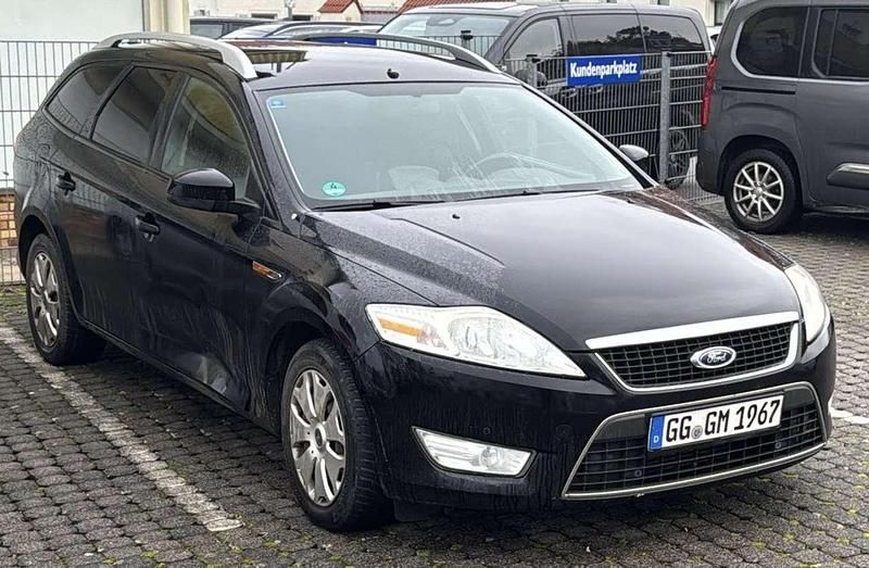 Pantherschwarz metallic Gebraucht 2010 Ford Mondeo Trend Kombi | 1.499 € - Bild 1/4