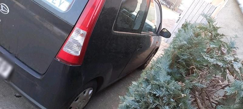 Gebraucht Daihatsu Cuore 58 PS (42 kW) 2005 Schwarz Kleinwagen