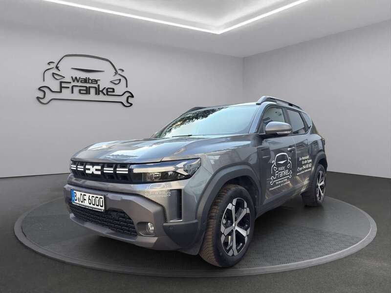 Dolomitgrau Gebraucht 2024 Dacia Duster Journey SUV | 28.599 € (Fairer Preis) - Bild 1/4