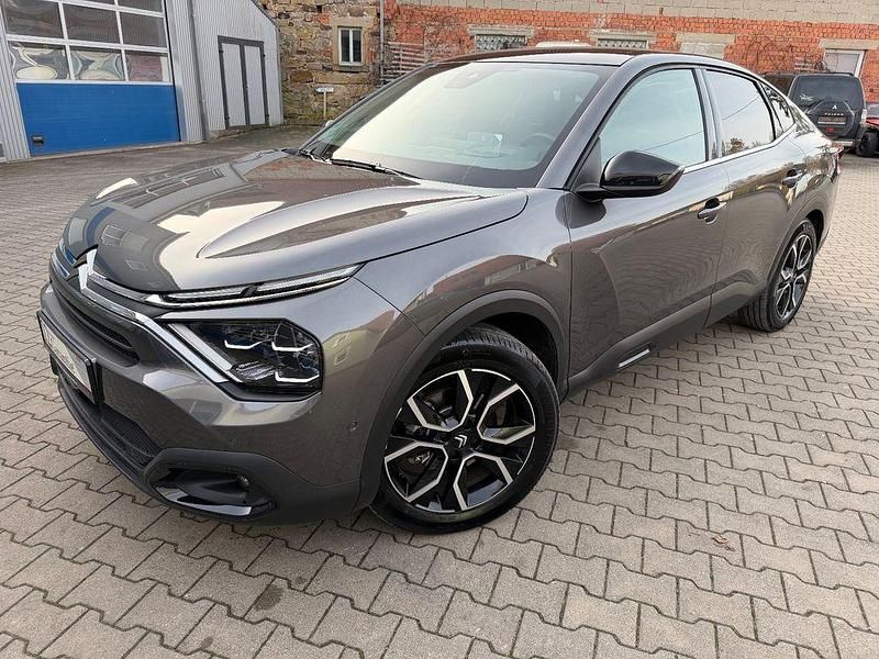 Grau Gebraucht 2024 Citroën e-C4 Limousine | 16.990 € (Superpreis) - Bild 1/4