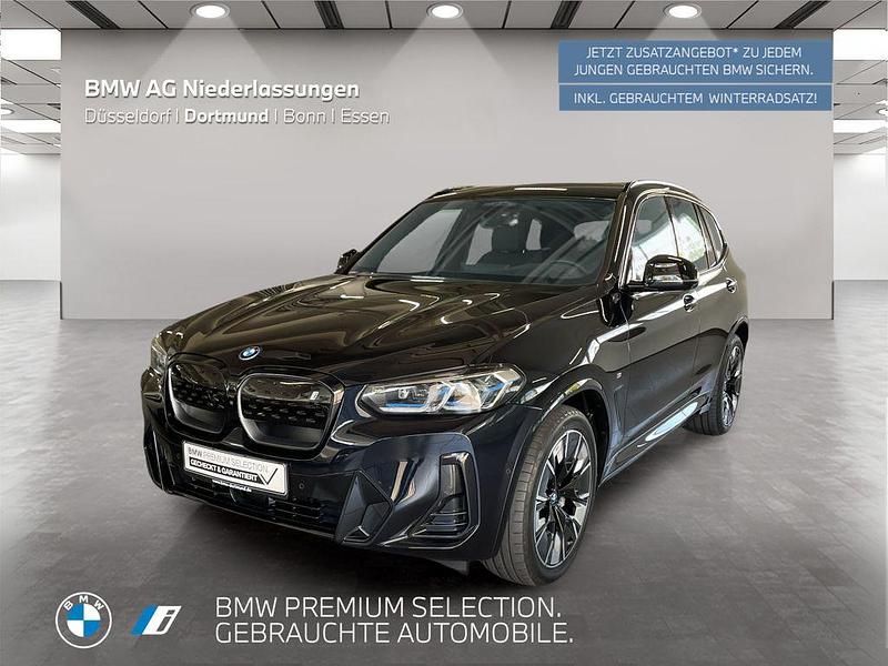 Schwarz (m carbonschwarz) Gebraucht 2024 BMW iX3 Impressive SUV | 55.499 € (Etwas zu teuer) - Bild 1/2