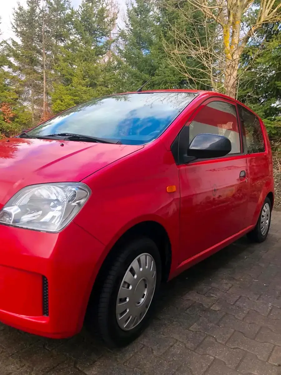 Gebraucht Daihatsu Cuore 54 PS (39 kW) 2004 Rot Kleinwagen