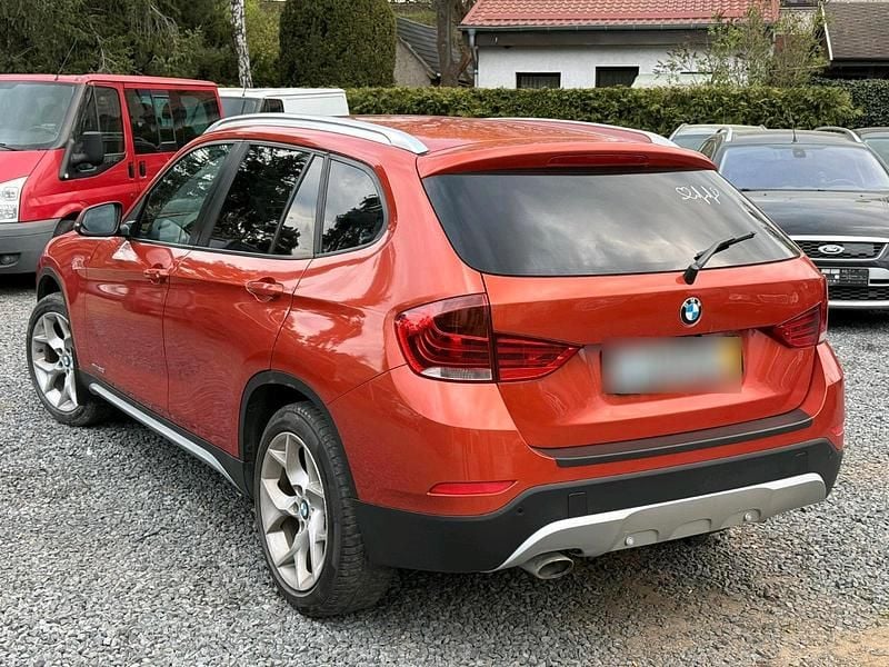 Second-hand BMW X1 177 CP (130 kW) 2012 Portocaliu SUV