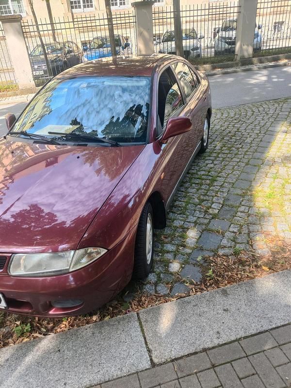 Rot Gebraucht 1995 Mitsubishi Carisma Limousine | 1.000 € - Bild 1/4