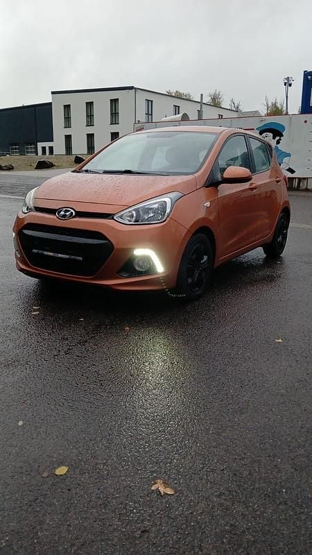 Orange Gebraucht 2014 Hyundai i10 Premium Kleinwagen | 4.200 € - Bild 1/4