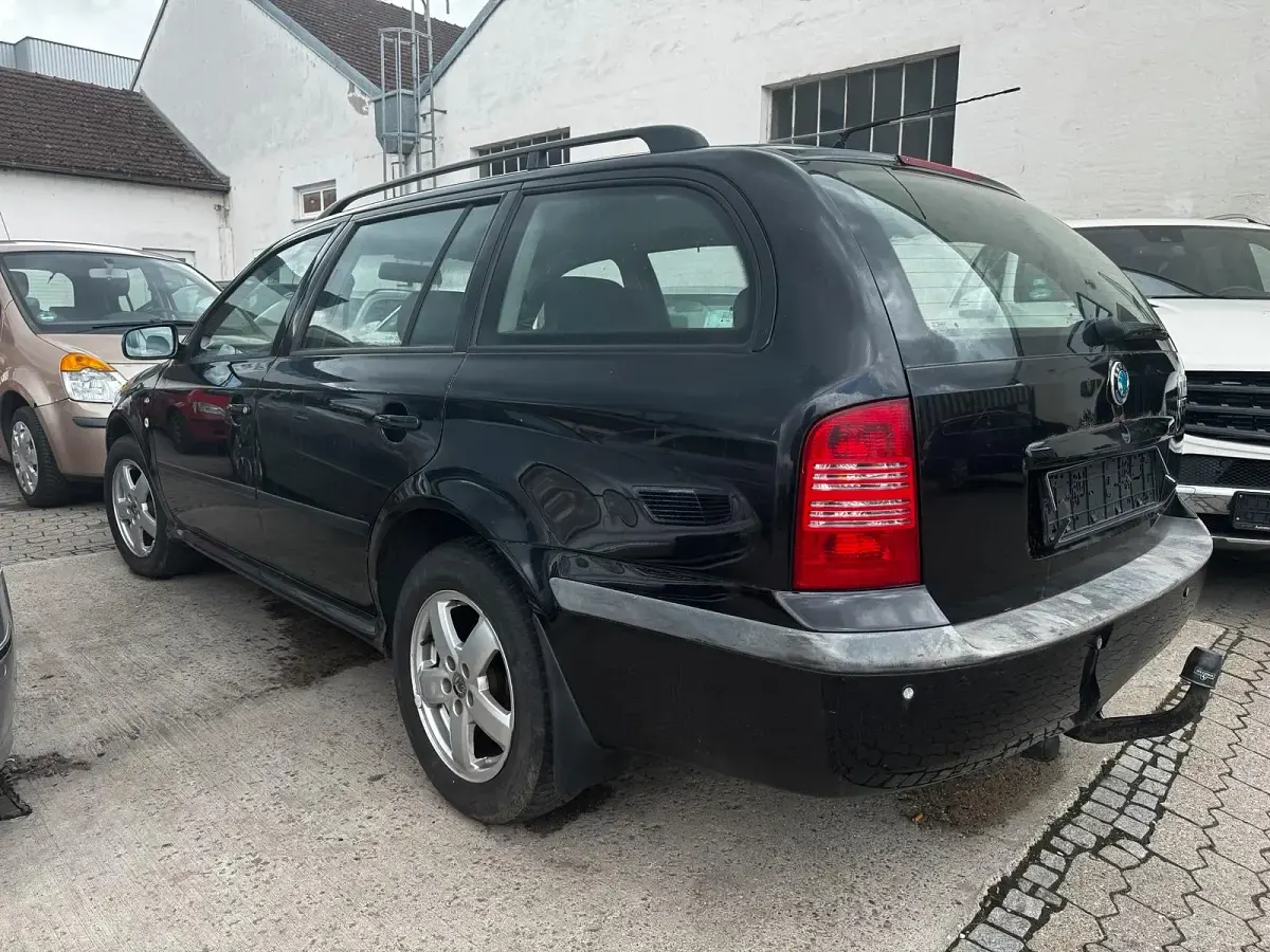 Używany Skoda Octavia 110 KM (80 kW) 2003 Czarny Kombi