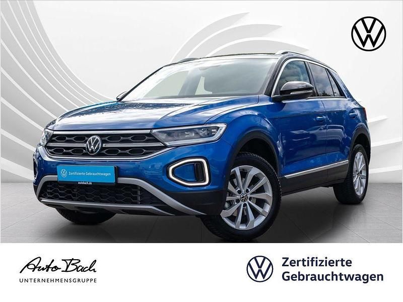 Blau (ravennablau metallic) Gebraucht 2023 VW T-Roc Style SUV | 21.940 € (Fairer Preis) - Bild 1/4