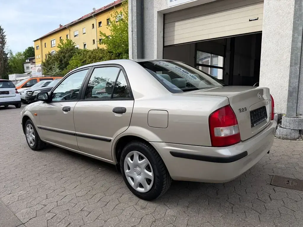 Second-hand Mazda 323 88 CP (64 kW) 1999 Gri Berlinǎ