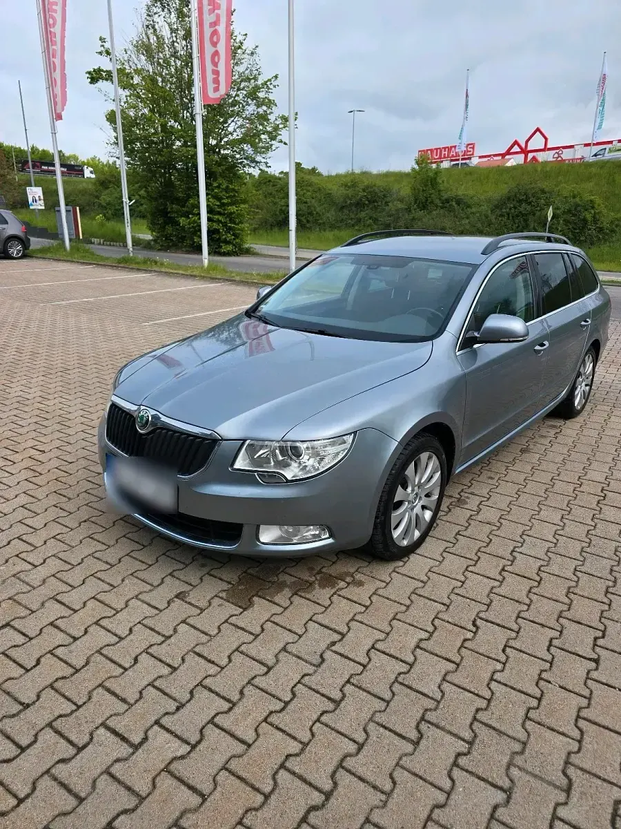 Używany Skoda Superb 140 KM (102 kW) 2012 Niebieski Kombi