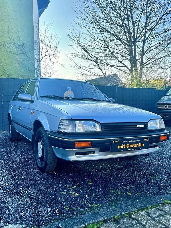 Gebraucht Mazda 323 60 PS (44 kW) 1989 Silber Kleinwagen