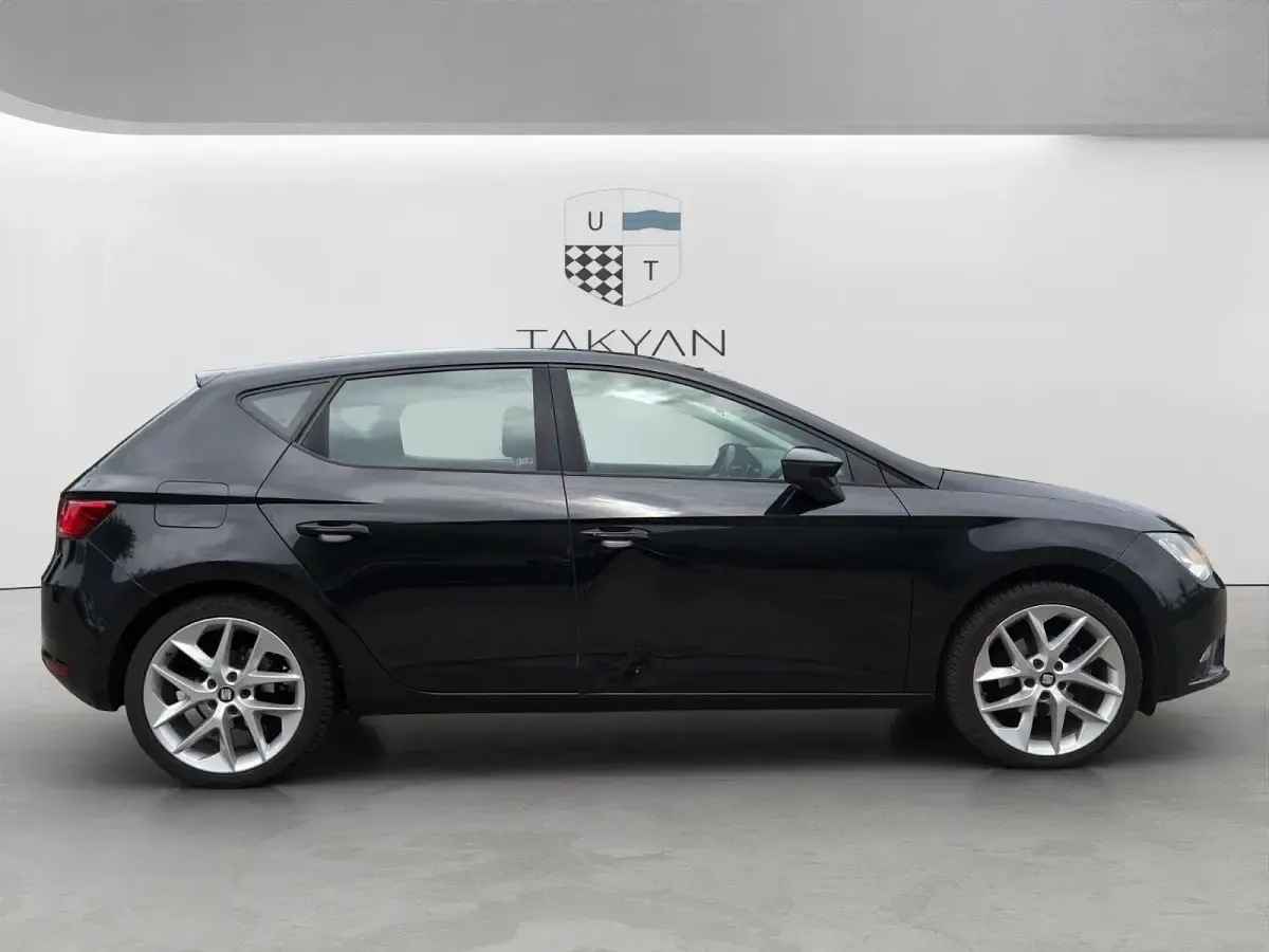 Używany Seat Leon Style 105 KM (77 kW) 2014 Czarny Kombi
