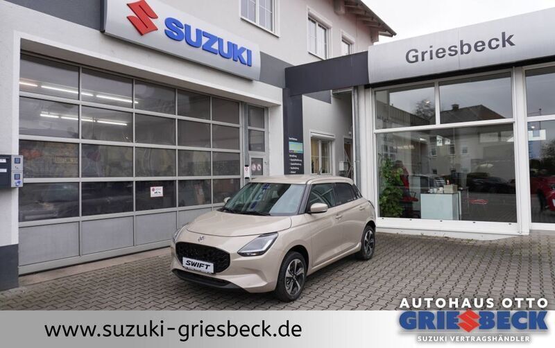 Beige Neu 2024 Suzuki Swift Comfort+ Limousine | 20.416 € - Bild 1/4