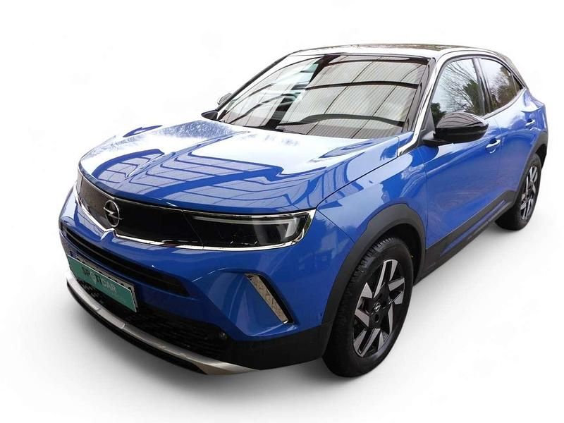 Voltaik blau Gebraucht 2023 Opel Mokka-e Elegance SUV | 37.599 € - Bild 1/4