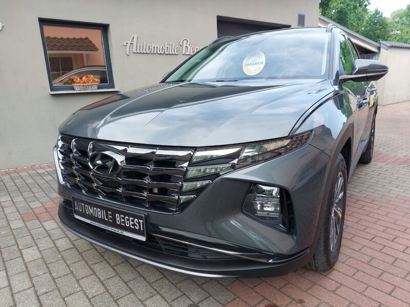 Grau Gebraucht 2021 Hyundai Tucson SUV | 26.299 € (Etwas zu teuer) - Bild 1/4