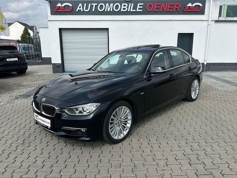 Black sapphire metallic Gebraucht 2013 BMW 335 Luxury Line Limousine | 15.490 € - Bild 1/4