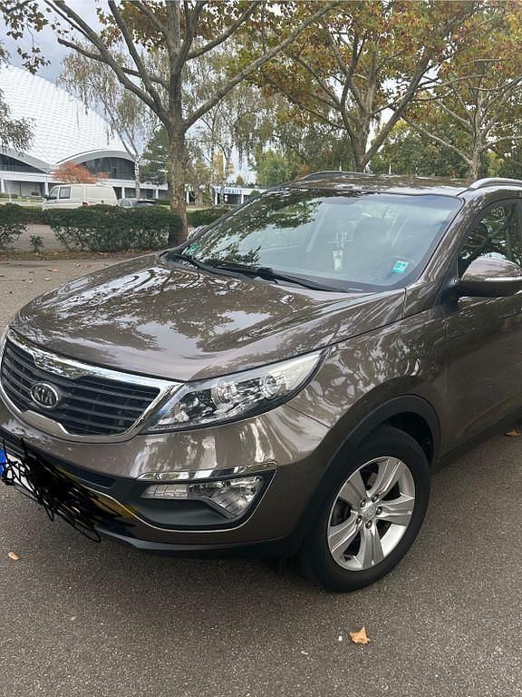Braun Gebraucht 2011 Kia Sportage Attract SUV | 5.500 € (Fairer Preis) - Bild 1/4