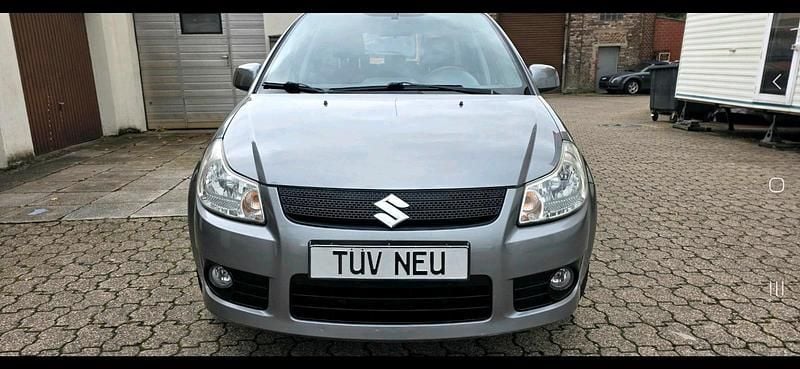 Grau Gebraucht 2006 Suzuki SX4 Kleinwagen | 3.990 € (Fairer Preis) - Bild 1/4