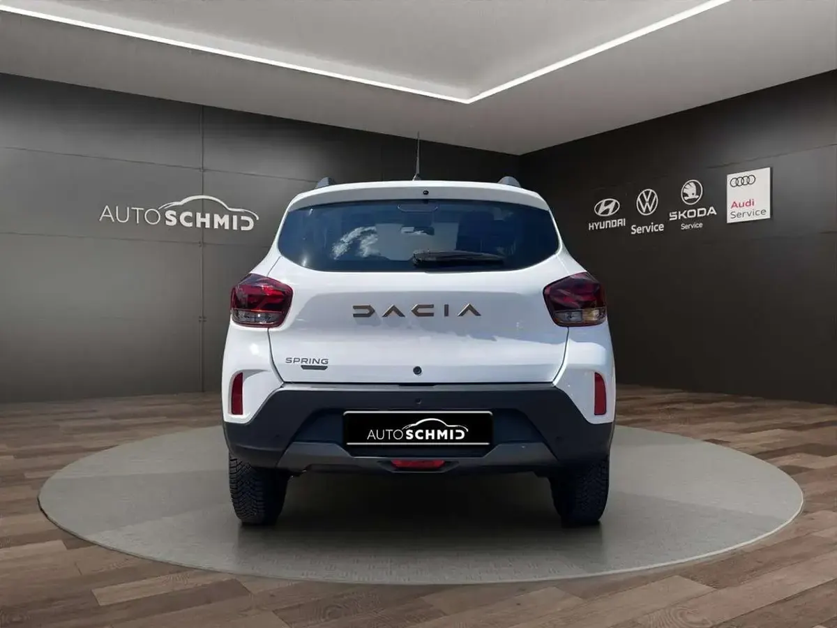 Gebraucht Dacia Spring Extreme 47 kW (65 PS) 2023 Polarweiss Kleinwagen