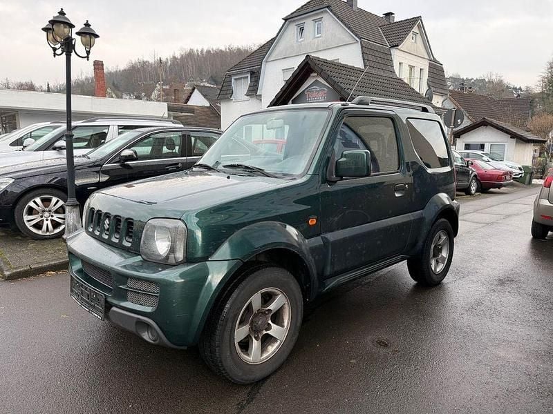 Grün Gebraucht 2006 Suzuki Jimny SUV | 6.450 € (Fairer Preis) - Bild 1/4