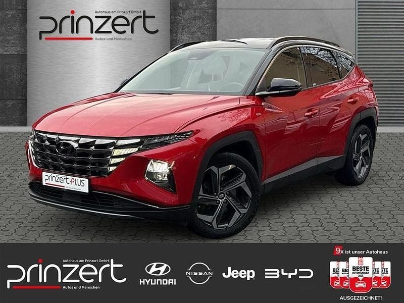 Engine red / phantom black / sol Gebraucht 2021 Hyundai Tucson Prime SUV | 24.970 € (Guter Preis) - Bild 1/4
