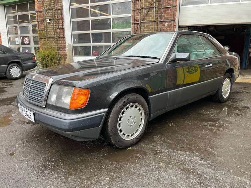 199 blauschwarzmetallic Gebraucht 1989 Mercedes E300 Coupé | 22.500 € - Bild 1/4