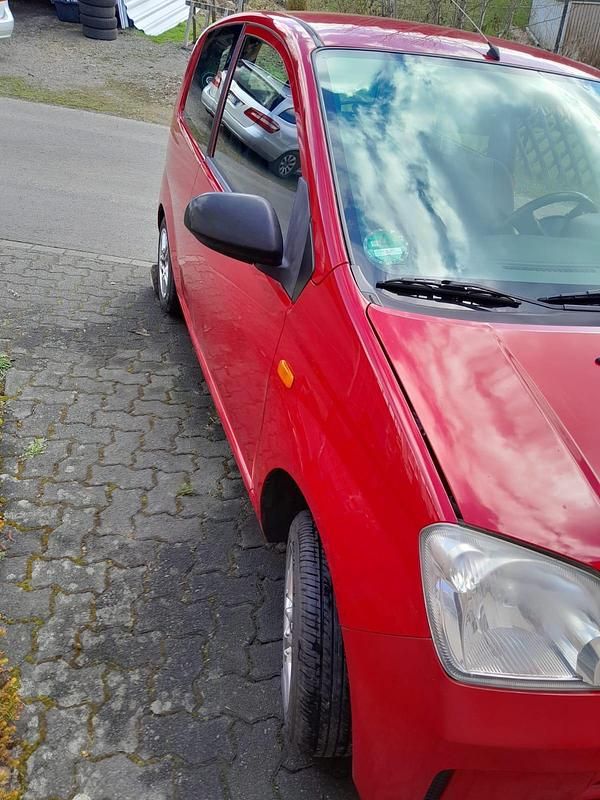 Gebraucht Daihatsu Cuore 58 PS (42 kW) 2006 Rot Kleinwagen
