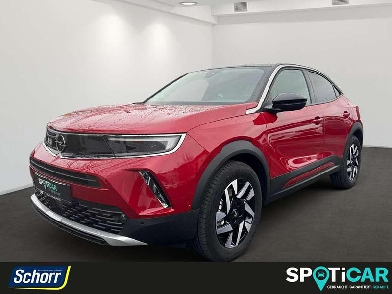 Kosmos rot Gebraucht 2023 Opel Mokka-e Elegance SUV | 27.850 € - Bild 1/4