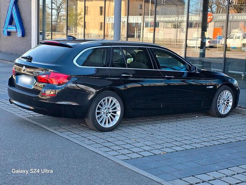 Gebraucht BMW 520 184 PS (135 kW) 2011 Schwarz Kombi