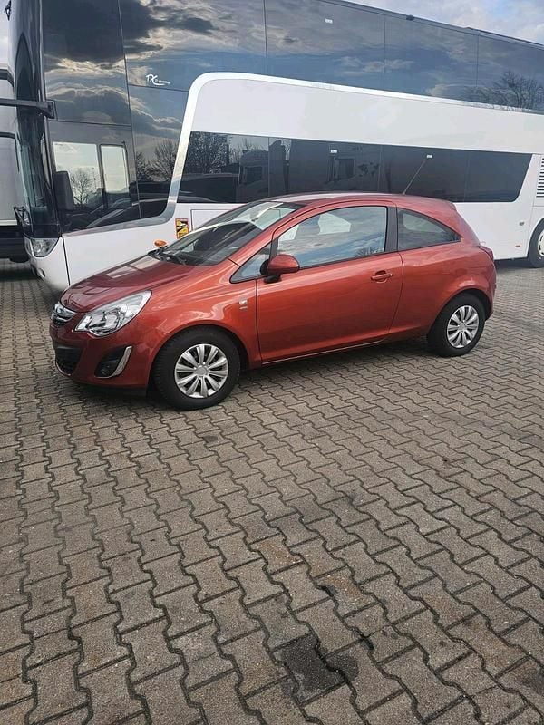 Second-hand Opel Corsa 100 CP (73 kW) 2012 Portocaliu Hatchback