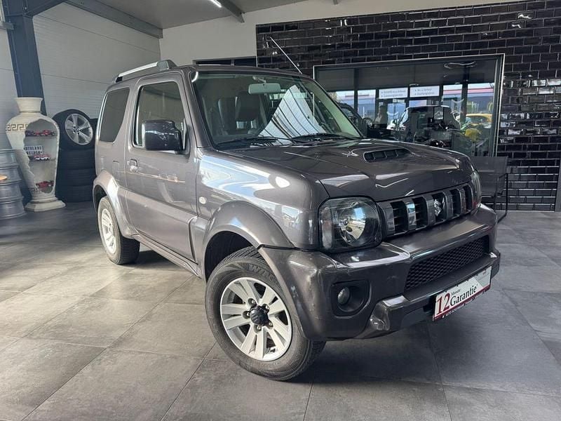 Grau Gebraucht 2014 Suzuki Jimny SUV | 9.650 € (Superpreis) - Bild 1/4
