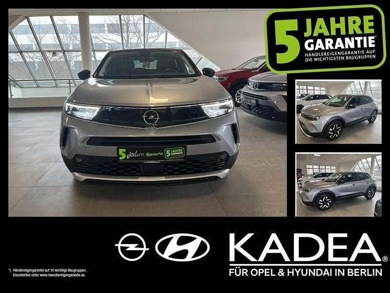 Gebraucht Opel Mokka Elegance 101 PS (74 kW) 2022 Kontrast grau/quarz silber (metallic) SUV