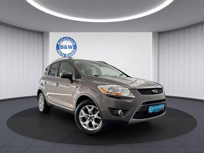 Brisbane braun (met.) Gebraucht 2012 Ford Kuga Champions Edition SUV | 7.899 € (Fairer Preis) - Bild 1/4