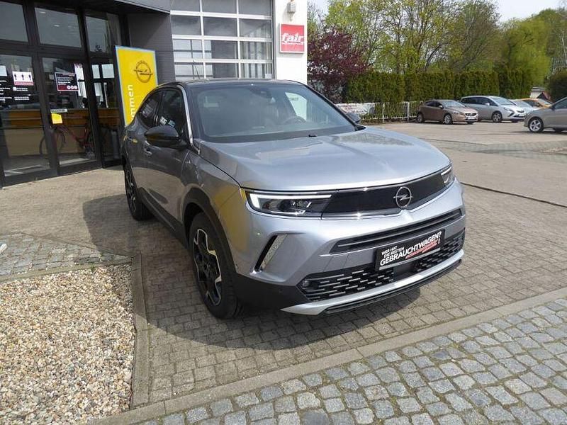 Gebraucht Opel Mokka-e Ultimate 100 kW (136 PS) 2023 Kontrast grau metallic SUV