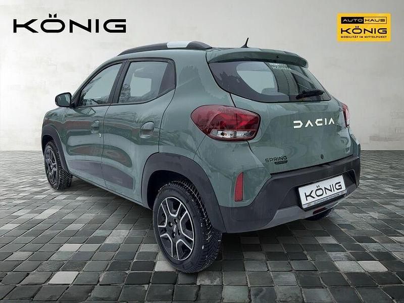 Gebraucht Dacia Spring Comfort 47 kW (65 PS) 2023 Olivgrün Kleinwagen