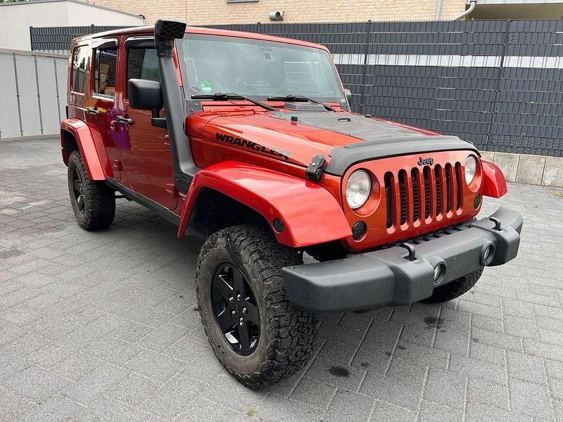 Orange Gebraucht 2009 Jeep Wrangler Unlimited Sport SUV | 16.500 € (Fairer Preis) - Bild 1/4