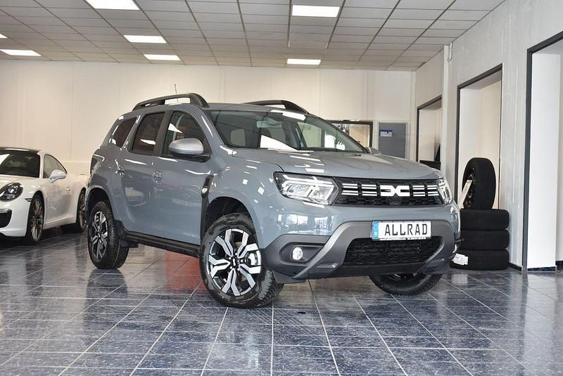Grau Gebraucht 2023 Dacia Duster Journey SUV | 29.570 € - Bild 1/4