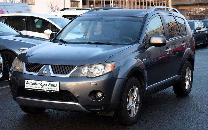 Grau Gebraucht 2009 Mitsubishi Outlander Intense SUV | 5.990 € (Fairer Preis) - Bild 1/4