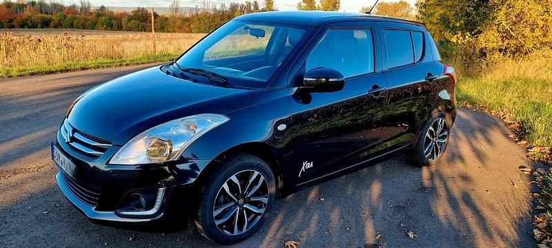 Schwarz Gebraucht 2015 Suzuki Swift X-TRA Kleinwagen | 7.499 € (Fairer Preis) - Bild 1/4