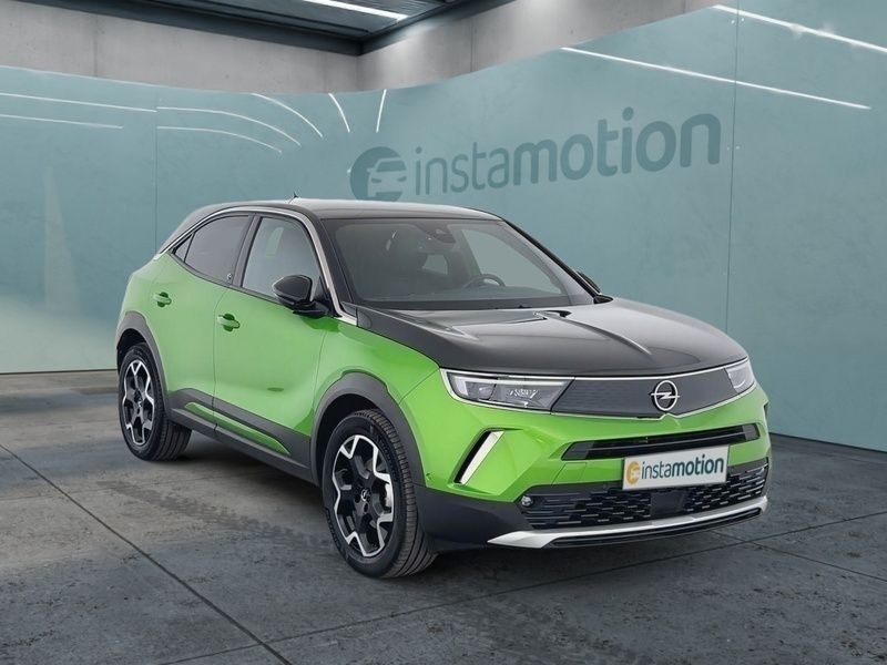 Grün Gebraucht 2021 Opel Mokka-e Ultimate SUV | 20.090 € (Teuer) - Bild 1/4
