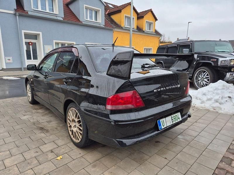 Second-hand Mitsubishi Lancer Evolution 280 CP (205 kW) 2001 Negru Berlinǎ