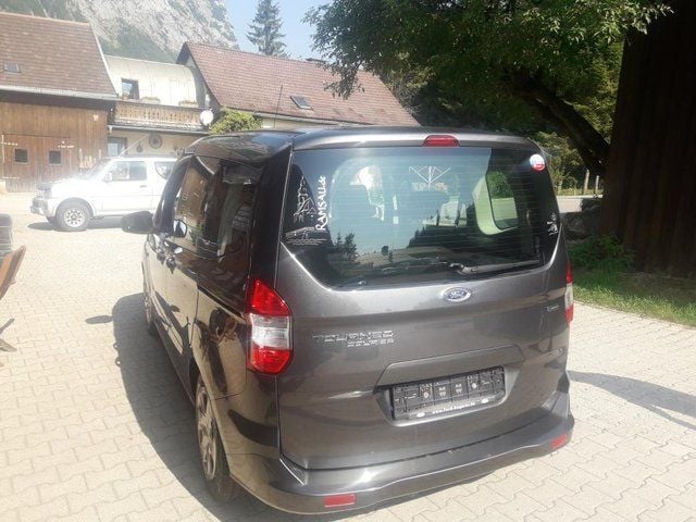 Gebraucht Ford Tourneo Courier Trend 101 PS (74 kW) 2016 Grau metallic Van / Kleinbus