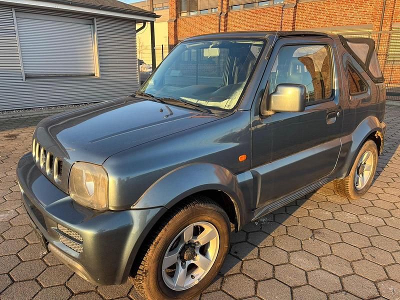 Grau Gebraucht 2009 Suzuki Jimny SUV | 6.490 € (Superpreis) - Bild 1/4