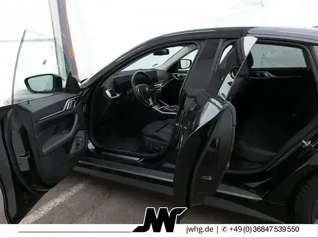 Gebraucht BMW i4 Sport Line 250 kW (340 PS) 2023 Black sapphire metallic Limousine