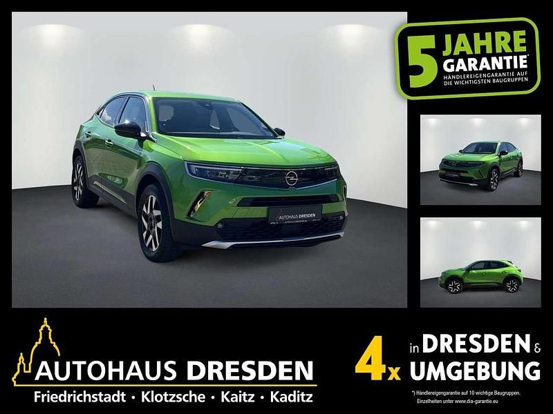 Gebraucht Opel Mokka-e Elegance 100 kW (136 PS) 2022 Matcha green (metallic) SUV