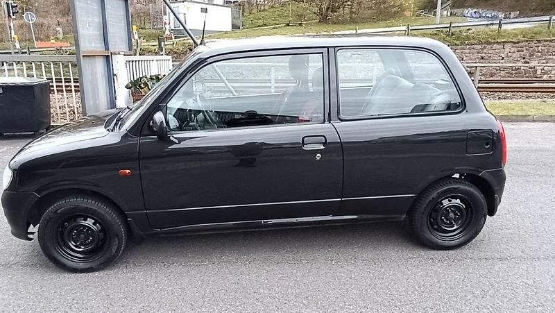 Gebraucht Daihatsu Cuore 56 PS (41 kW) 1999 Schwarz Kleinwagen