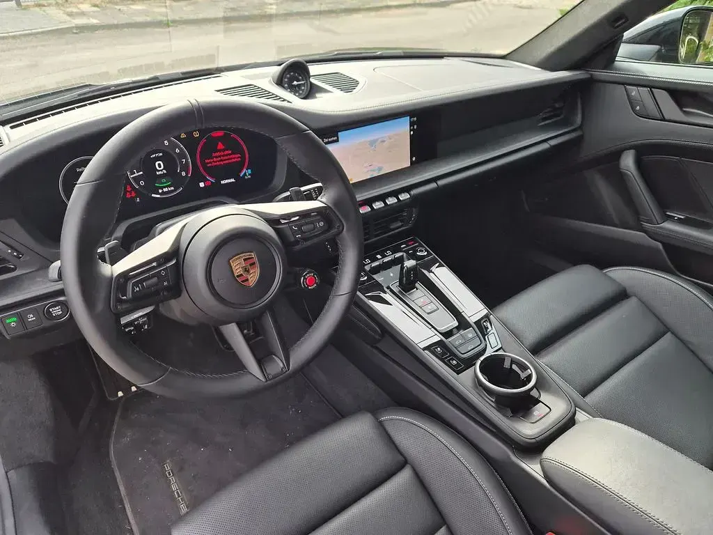 Gebraucht Porsche 911 485 PS (356 kW) 2025 Tiefschwarzmetallic Coupé