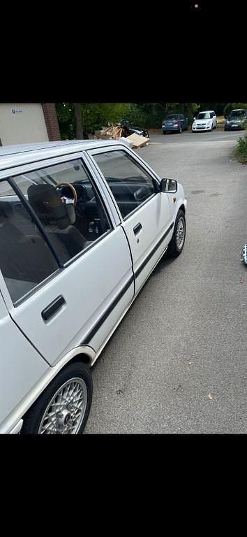 Gebraucht Daihatsu Cuore 41 PS (30 kW) 1989 Weiß Kleinwagen