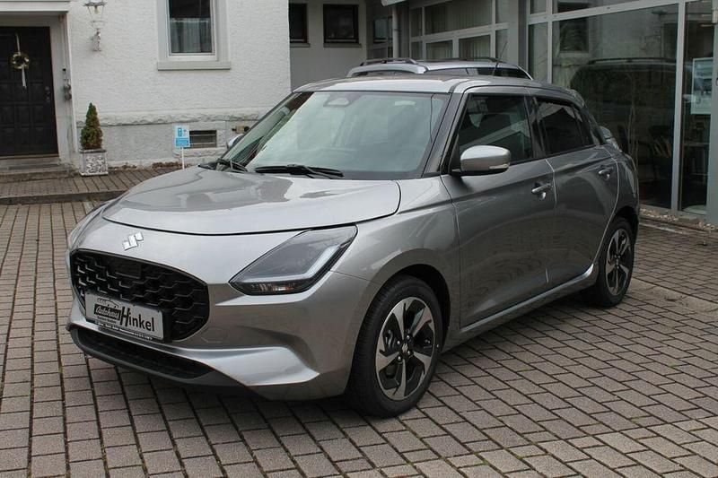 Silber Neu 2025 Suzuki Swift Comfort+ Kleinwagen | 21.490 € - Bild 1/4