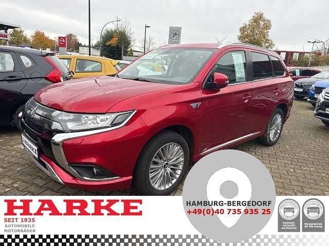 Dynamic red premium (metallic) Gebraucht 2021 Mitsubishi Outlander P-HEV Spirit SUV | 19.600 € (Fairer Preis) - Bild 1/4