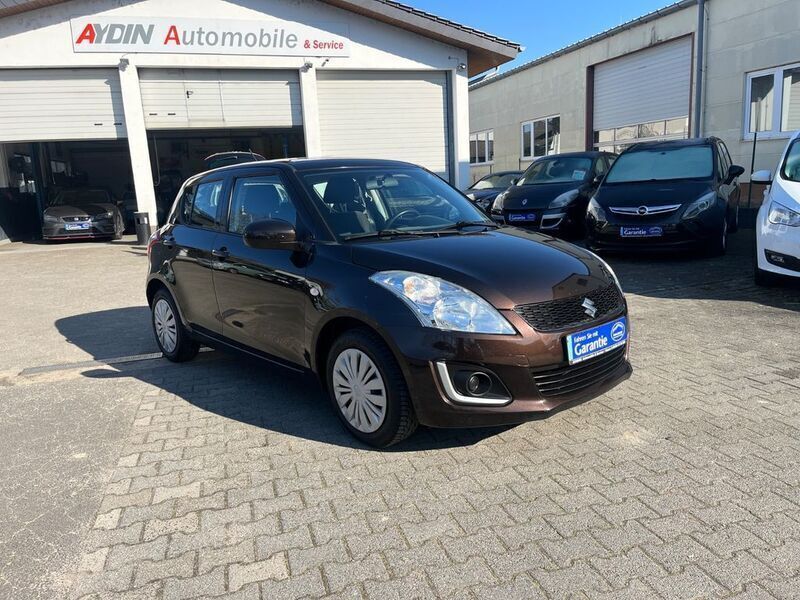 Braun Gebraucht 2015 Suzuki Swift Comfort Limousine | 5.700 € (Guter Preis) - Bild 1/4